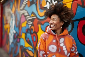 Obraz na płótnie Canvas Portrait of a blissful afro-american woman in her 40s dressed in a comfy fleece pullover against a vibrant graffiti wall. AI Generation