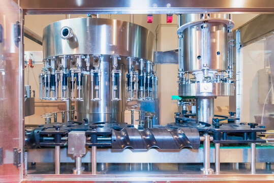 Automatic wine filling machine in modern factory