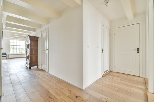 Spacious and bright empty room with wooden floors