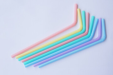 Fototapeta premium Colorful plastic drinking straws tubes for juice and cocktails. Concept, single use equipment for drinking, but can use for diy crafts for decoration. 