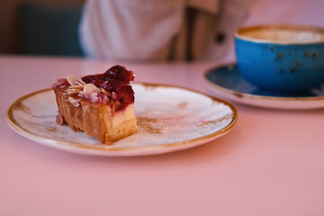 Eating Bite Of Raspberry Tart Cake. Eat Delicious Sweet Dessert. Pastry In Restaurant, Cafe. Cutting Creamy Texture Closeup. Person Taking Bite Slice of Shortcrust Cake. Breaks Off Piece of Berry Cake