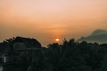 Beautiful sunrise in tropical landscape in front of sacred mountain of Arunachala