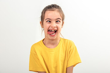 Little Caucasian girl makes funny faces on a white background isolated. - Powered by Adobe