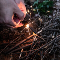 lighting a fire in the forest