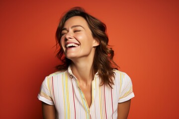 Portrait of a grinning woman in her 30s donning a classy polo shirt against a soft multicolor background. AI Generation