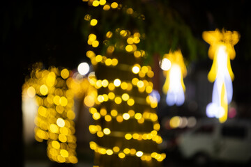 Blurred christmas lights decoration. Out of focus christmas street lights creating the bokeh effect
