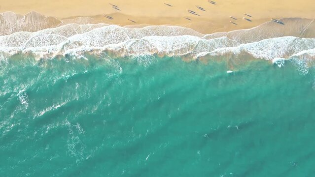 Summer seascape beautiful waves, blue sea water in sunny day. Esquinzo beach, Spain, Canary Island Top view from drone. Sea aerial view, tropical nature Beautiful bright sea waves splashing 
