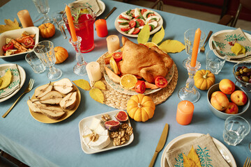 Medium high angle shot of freshly cooked food displayed on thanksgiving table for celebration
