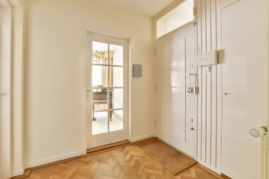 Foyer with white doors and door
