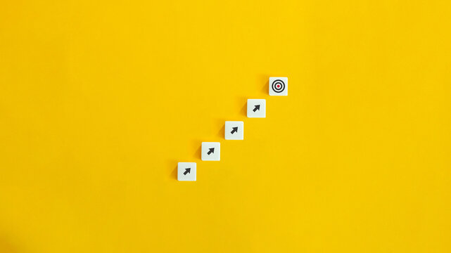 Business Plan, Strategy and Success Concept Image. Goal Achievement, Meet the Target.

Letter Tiles on Yellow Background. Minimal Aesthetics.