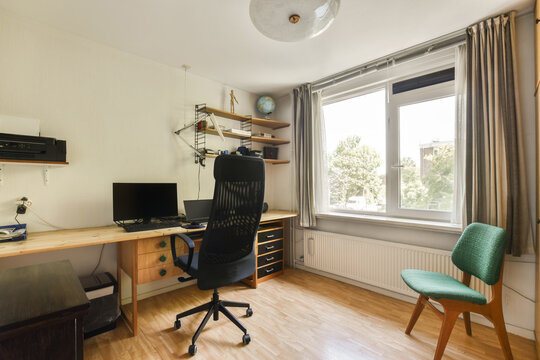 Home office with desk and window