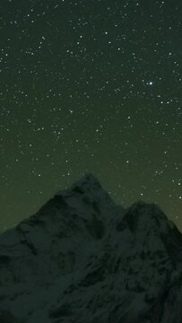 Night Sky over Ama Dablam Mountain. Himalaya, Nepal. Timelapse. Vertical Video