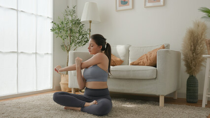 Focused Stretch, Woman Practicing Seated Yoga Pose in Serene Home