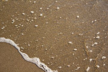 
It is a sandy beach with sea water.