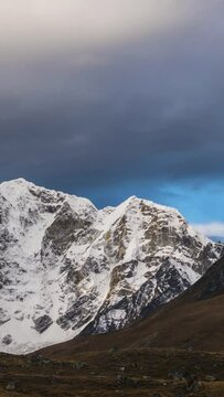 Taboche and Cholatse Mountains and Cloudy Sky in the Morning. Himalaya, Nepal. Timelapse. Vertical Video