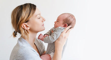 Mother and baby at home. Happy maternity and family.