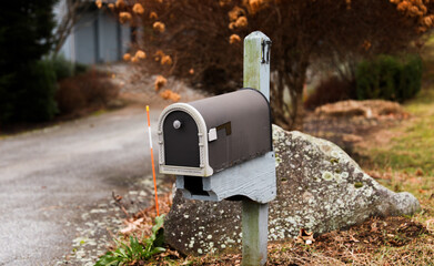 mailbox outside suburban home, symbolizing communication and connection