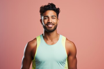 Fototapeta na wymiar Portrait of a content indian man in his 20s wearing a lightweight running vest against a pastel or soft colors background. AI Generation