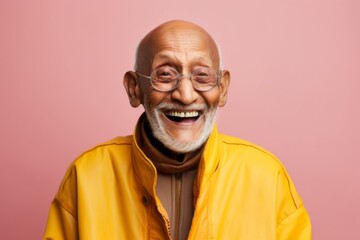 Portrait of a cheerful indian elderly 100 years old man wearing a functional windbreaker against a pastel or soft colors background. AI Generation