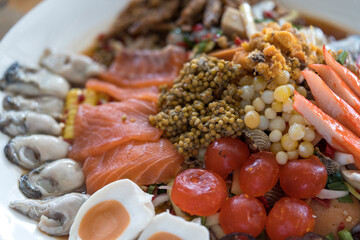 Thai food style salad mixed with egg and seafood. Close up