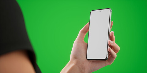 Caucasian woman holding phone on a green background, blank screen mockup