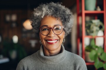 Portrait of a satisfied afro-american woman in her 70s dressed in a comfy fleece pullover against a stylized simple home office background. AI Generation - obrazy, fototapety, plakaty