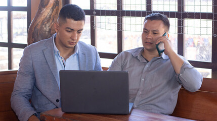 businessmen closing deals with cell phones