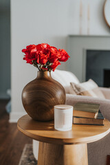 vase with red roses in a livingroom