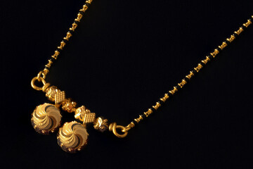 Still life image traditional Indian Hindu wedding necklace of  a bride called mangalsutra with...