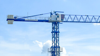 View of blue tower crane which the structures are made of steel