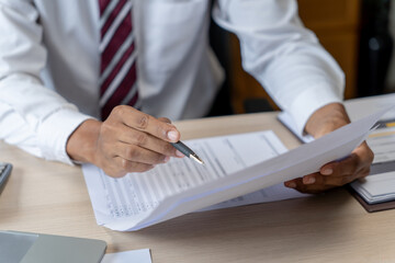 Business man working with laptop. Young business man thinking Concentrated at work.