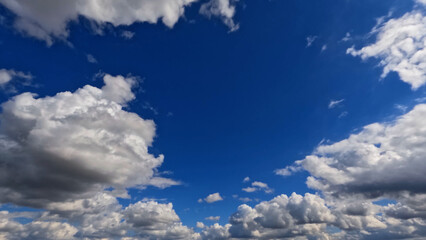 Fototapeta na wymiar beautiful large clouds in the blue sky background - photo of nature