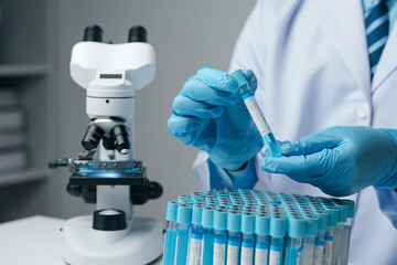 Scientists conducting research investigations in a medical laboratory. Scientist wearing medical gloves nanotechnology, research, fiber, microbiology, glass, test tube, medicine - obrazy, fototapety, plakaty