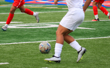 A Group of Young men Engaged in a Game of Soccer