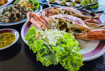 Top view of variety Seafood party table with scallop, cockle, crab, clams, shrimps, crayfish on...