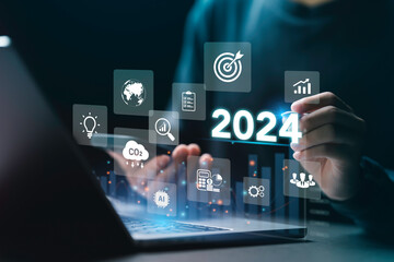 Businessman plan strategy marketing and finance to goal in 2024 planning business growth with technology AI and environmental care to New Year resolutions business. digital transformation 2024 - obrazy, fototapety, plakaty