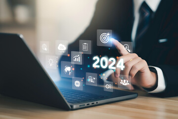 Businessman plan strategy marketing and finance to goal in 2024 planning business growth with technology AI and environmental care to New Year resolutions business. digital transformation 2024