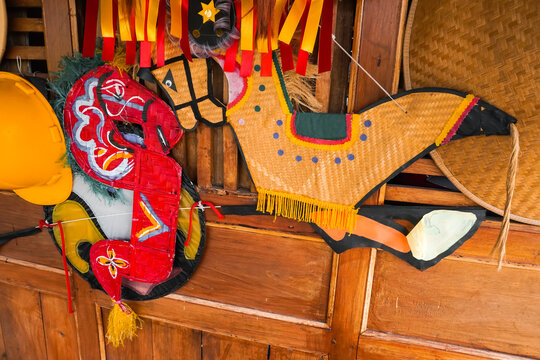 Kuda Lumping or Flat Horse made from woven bamboo hanging on traditional javanese joglo house wall. Traditional dance from Ponorogo, Java, Indonesia.