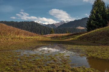 Fototapeta na wymiar Boar lake in Zailiyskiye Alatau mountains in Kazakhstan Almaty.