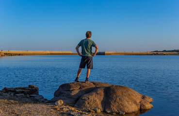 Man tourist standing overlooking the lake