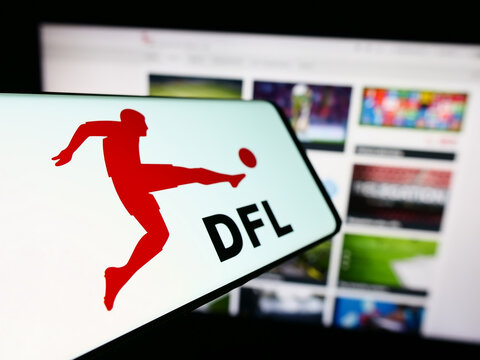 Stuttgart, Germany - 12-07-2023: Smartphone with logo of German football company DFL Deutsche Fu&szlig;ball Liga GmbH in front of website. Focus on center-left of phone display.