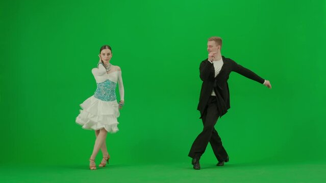 Elegant Ballroom Dance Couple in Action chroma key.