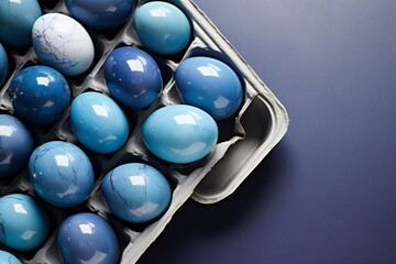 easter eggs painted blue. Easter blue eggs in a tray on a dark table
