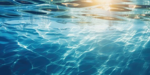 The sun is shining through the water in the pool.