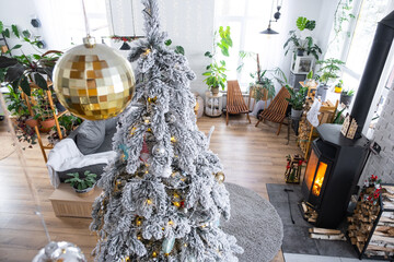 Festive white modern interior of house is decorated for Christmas and New Year in loft style with...