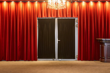 Elegant red velvet curtain. Theater cinema entrance. Show presentation