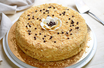 Delicious Napoleon Cake, Delicate Handmade Dessert with Custard and Puff Pastry Layers on Bright Background