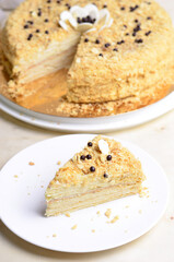 Delicious Napoleon Cake, Delicate Handmade Dessert with Custard and Puff Pastry Layers on Bright Background