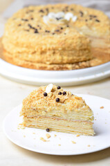 Delicious Napoleon Cake, Delicate Handmade Dessert with Custard and Puff Pastry Layers on Bright Background