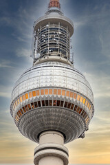 Detail of the Berlin TV Tower at Alexanderplatz in Berlin Mitte with dramatic sunset sky